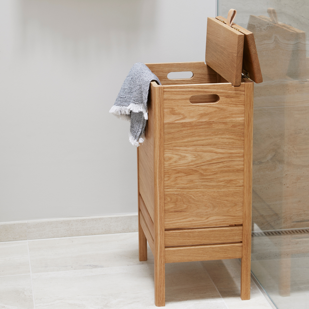 The A Line Laundry Box by Form and Refine is an aesthetically pleasing solution to the everyday challenge of disguising laundry. We love the thoughtful detail of the leather handle used to lift the lid of this storage piece, and how nicely it pairs with both the Natural and White Oak colourways.