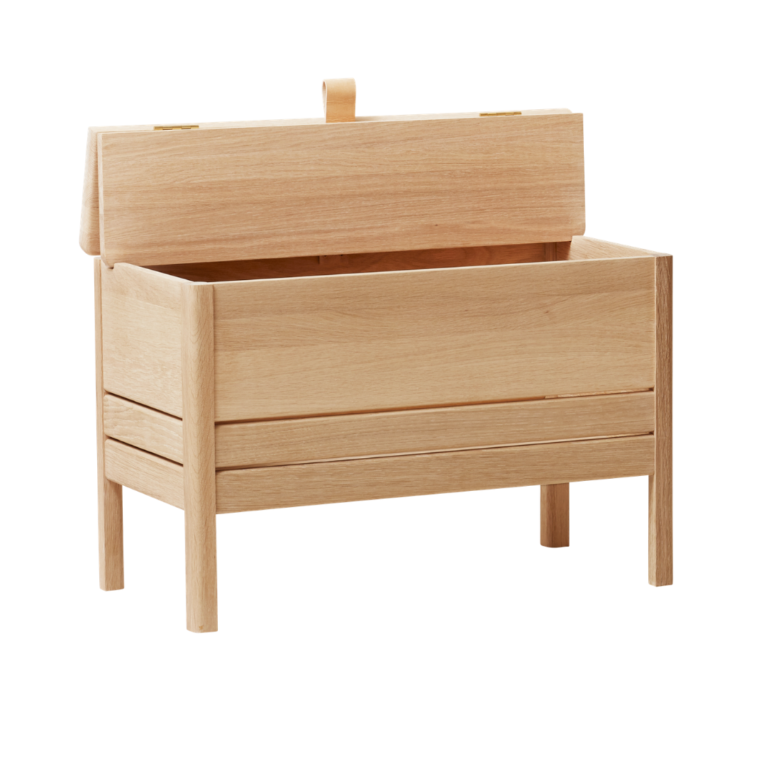The A Line Storage Bench by Form and Refine is an updated and minimal storage bench with clean lines and solid wood construction, perfect for entryways and bedrooms.