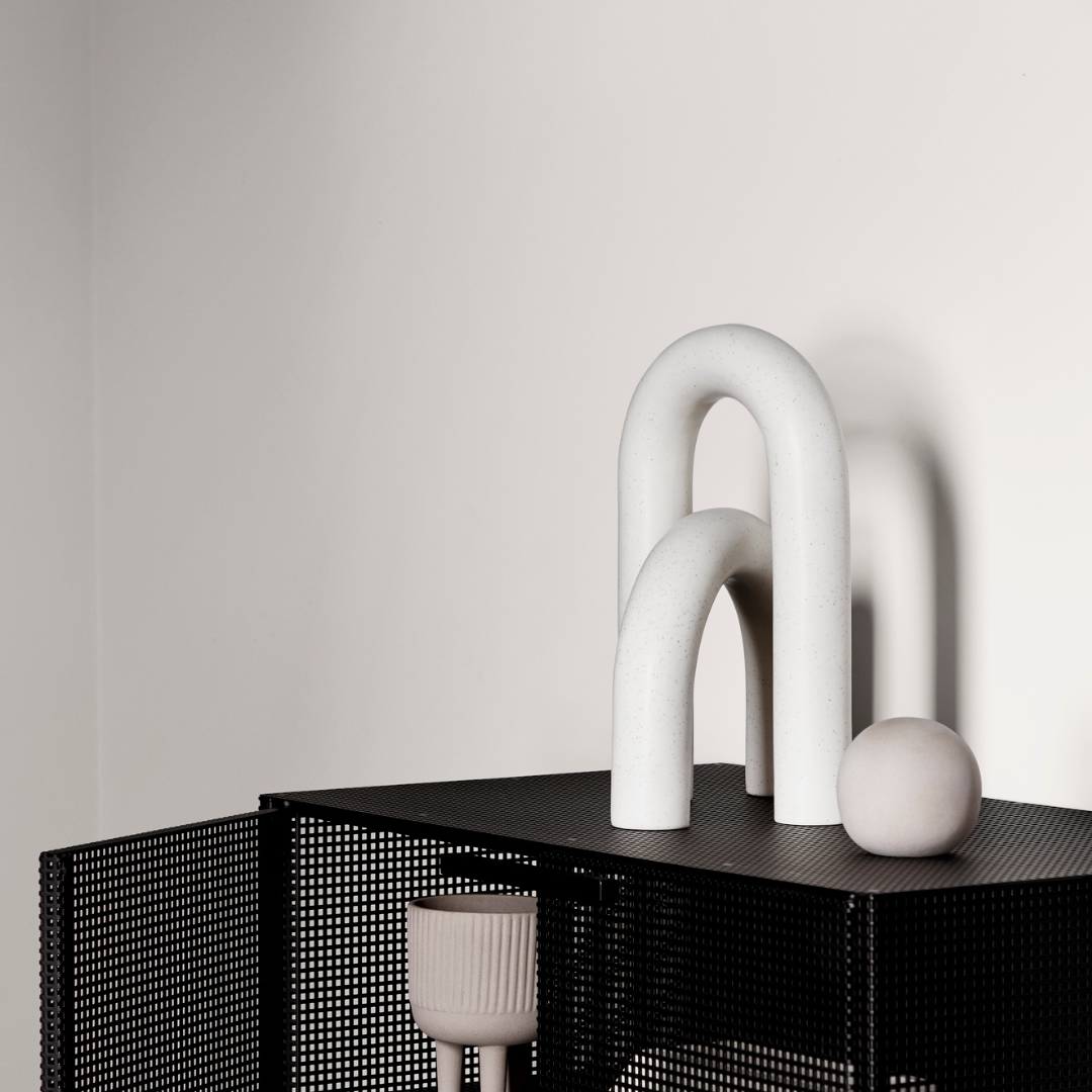 The Cupola Sculpture by Kristina Dam is a captivating and playful three-piece sculpture that is inspired by architectural shapes of arches and pillars. We love it's fluid shapes, and versatile uses. It's linear and smooth shape flows organically without rigidity and is intensely attractive when displayed in the modern and minimalistic home.