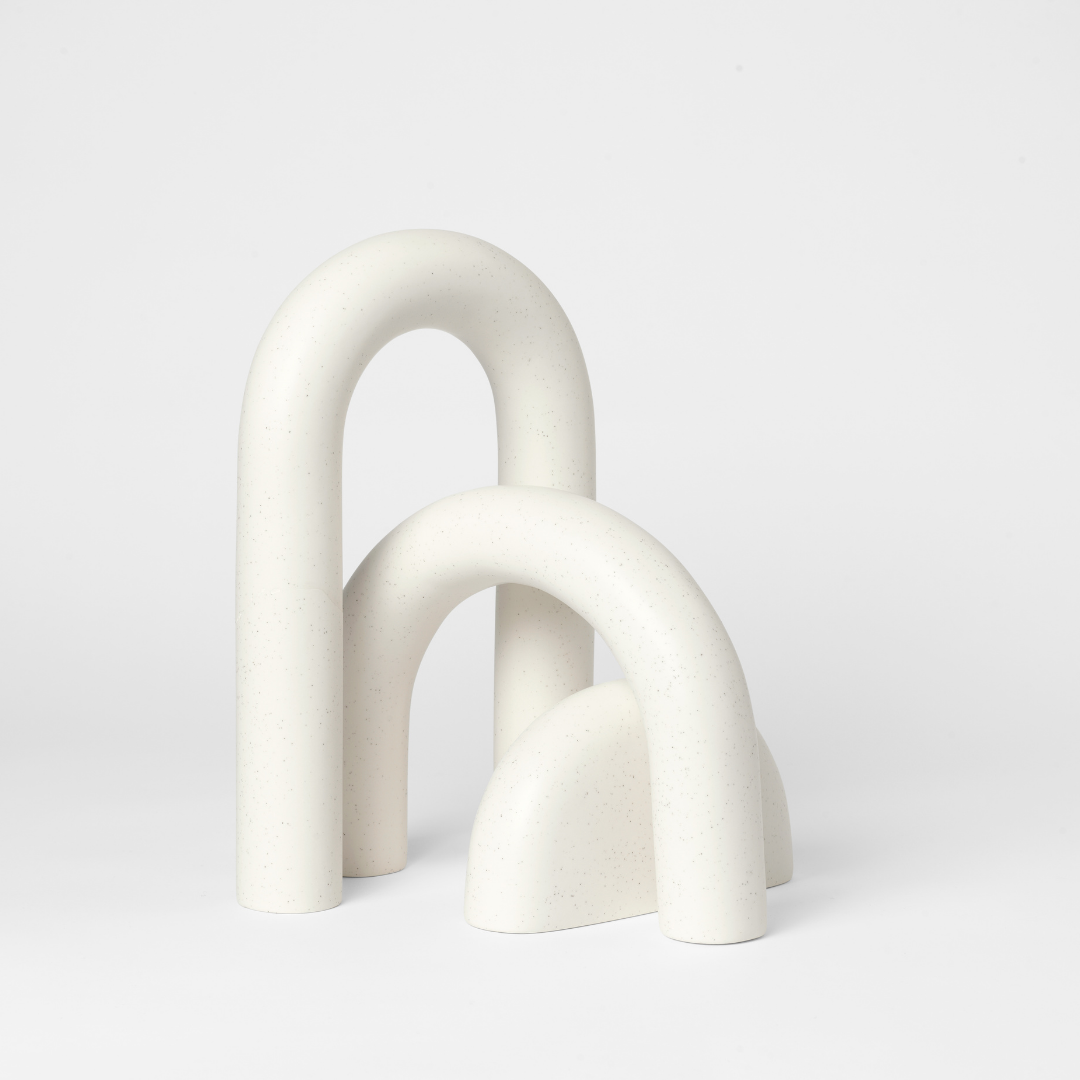 The Cupola Sculpture by Kristina Dam is a captivating and playful three-piece sculpture that is inspired by architectural shapes of arches and pillars. We love it's fluid shapes, and versatile uses. It's linear and smooth shape flows organically without rigidity and is intensely attractive when displayed in the modern and minimalistic home.