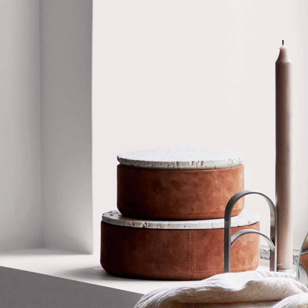 The Suede Box by Kristina Dam is a special container for any space of your home that needs a luxe upgrade for small storage. Made from suede and travertine - this small container is perfect for the bathroom, bedroom or home office - as it perfectly holds jewelry, paper clips or cotton swabs in a well-styled manner.