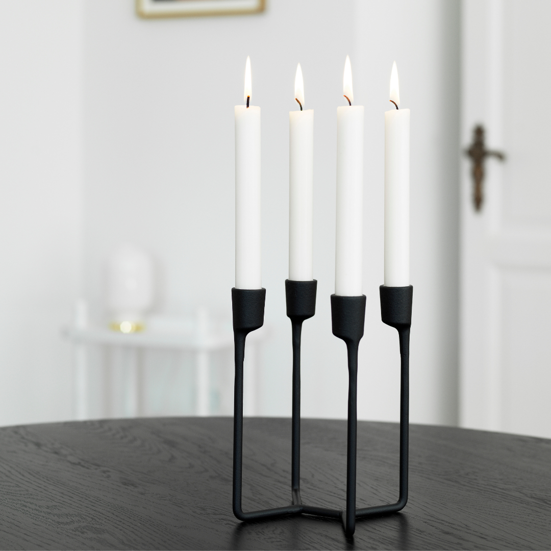 The Normann Copenhagen Heima 4-armed Candlestick in Black is the perfect addition to a well-styled home. We love it styled as a dining room centerpiece or on an entryway table. Paying homage to industrial, Nordic design - the Heima is sculptural yet minimalistic. The Heima is special enough for celebrations but simple and stylish enough for everyday use. Made of cast iron, this decor piece is made to last and will be one of your favorite candle holders.