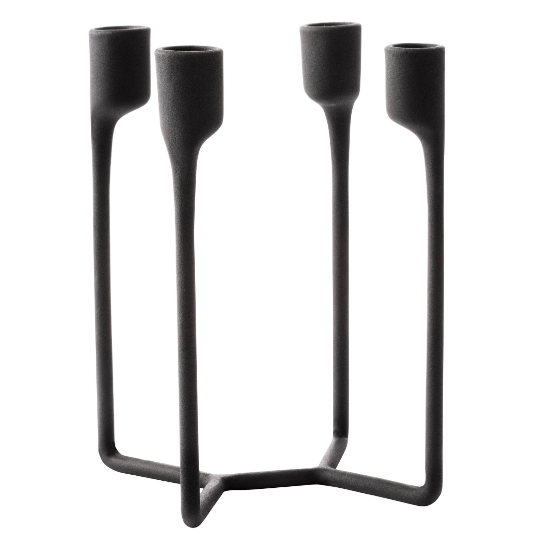 The Normann Copenhagen Heima 4-armed Candlestick in Black is the perfect addition to a well-styled home. We love it styled as a dining room centerpiece or on an entryway table. Paying homage to industrial, Nordic design - the Heima is sculptural yet minimalistic. The Heima is special enough for celebrations but simple and stylish enough for everyday use. Made of cast iron, this decor piece is made to last and will be one of your favorite candle holders.