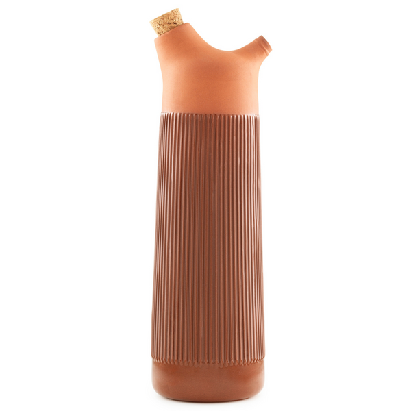 The Junto Carafe by Normann Copenhagen was inspired by traditional Spanish ceramics in a beautiful fired terracotta. We love the organic shape of the handmade stoneware, which creates the perfect spout for pouring water or juice from the carafe.