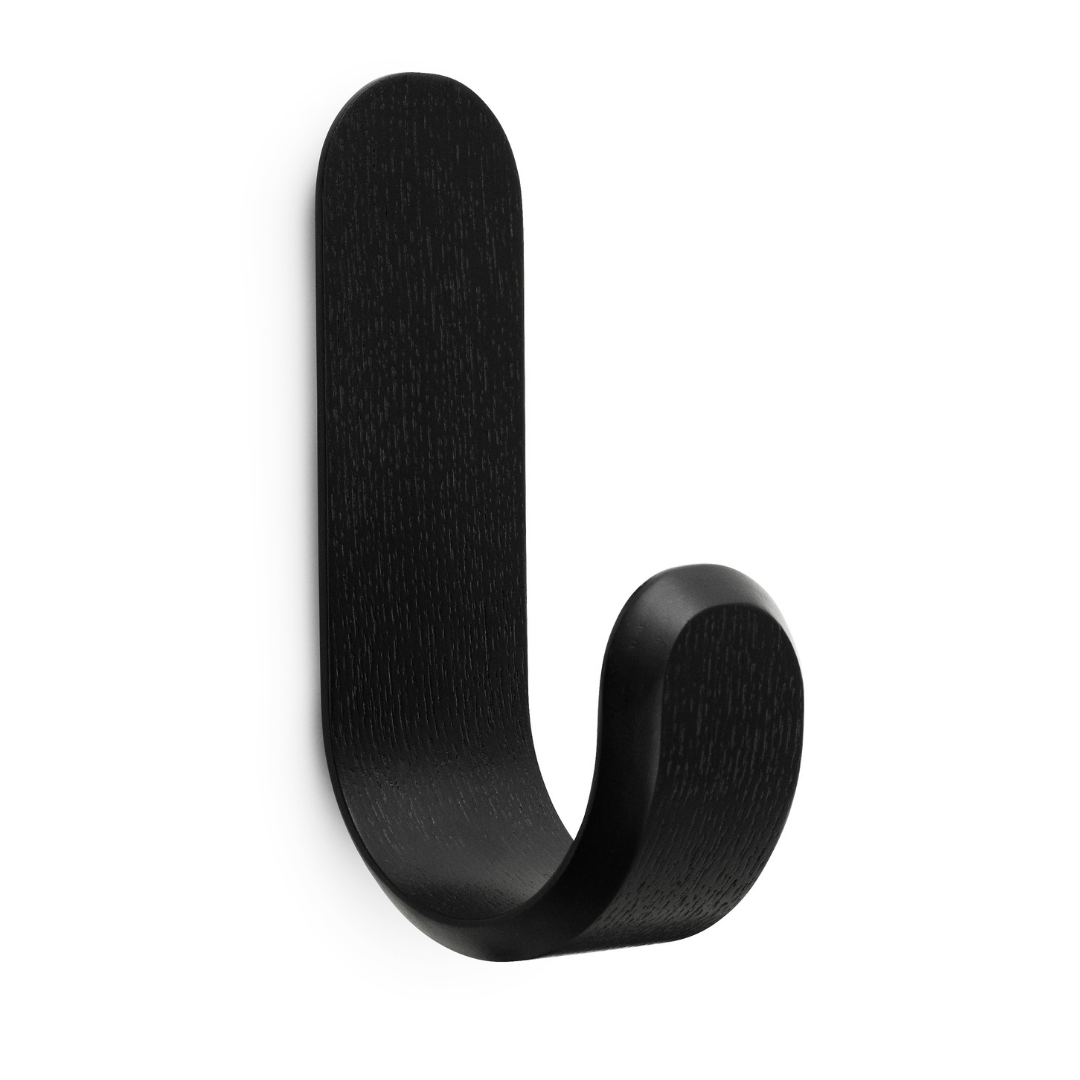 The Curve Hook by Normann Copenhagen was designed in collaboration with Danish designer Peter Johansen as a modern take on the classic hook often found in the entryway of the home.