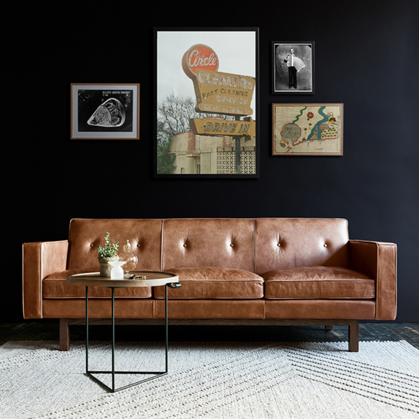 Embassy Chair Saddle Leather Brown Lifestyle Image in Living Room with Gallery Wall