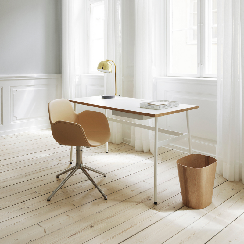 The Journal Desk by Normann Copenhagen celebrates simple and modern design that fits into any space throughout the home. This minimal desk offers all the essentials including a hole for power cords and a sleek steel drawer for daily-used office supplies.