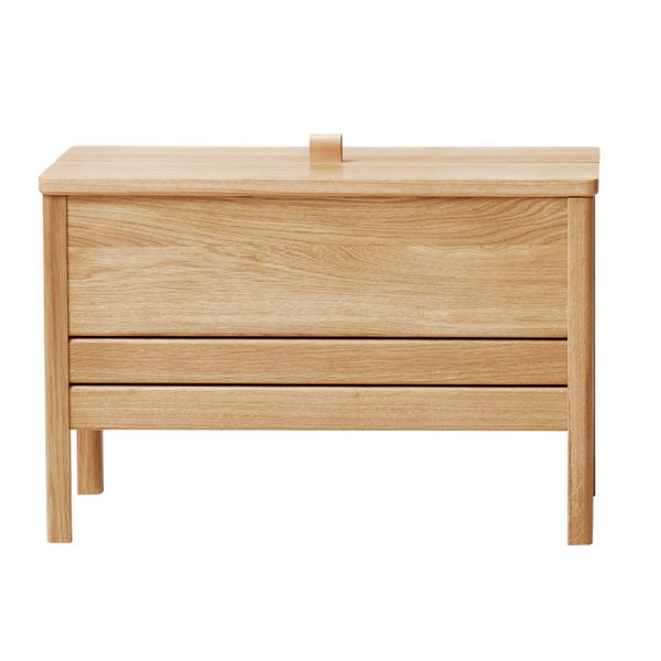 The A Line Storage Bench by Form and Refine is an updated and minimal storage bench with clean lines and solid wood construction, perfect for entryways and bedrooms.
