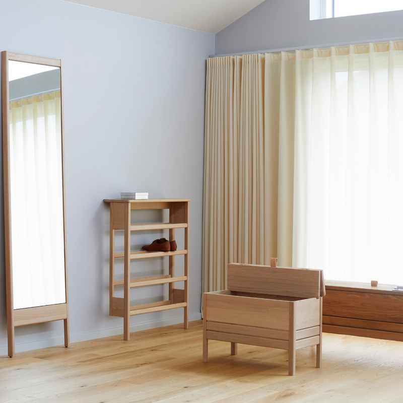 The A Line Storage Bench by Form and Refine is an updated and minimal storage bench with clean lines and solid wood construction, perfect for entryways and bedrooms.