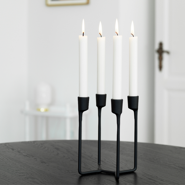 The Normann Copenhagen Heima 4-armed Candlestick in Black is the perfect addition to a well-styled home. We love it styled as a dining room centerpiece or on an entryway table. Paying homage to industrial, Nordic design - the Heima is sculptural yet minimalistic.  The Heima is special enough for celebrations but simple and stylish enough for everyday use. Made of cast iron, this decor piece is made to last and will be one of your favorite candle holders.