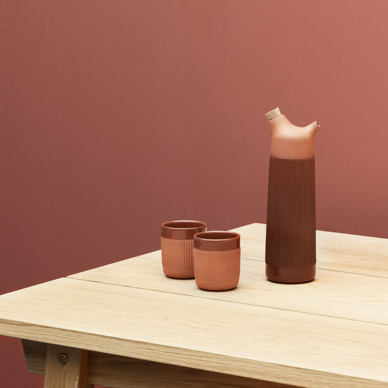 The Junto Carafe by Normann Copenhagen was inspired by traditional Spanish ceramics in a beautiful fired terracotta. We love the organic shape of the handmade stoneware, which creates the perfect spout for pouring water or juice from the carafe.
