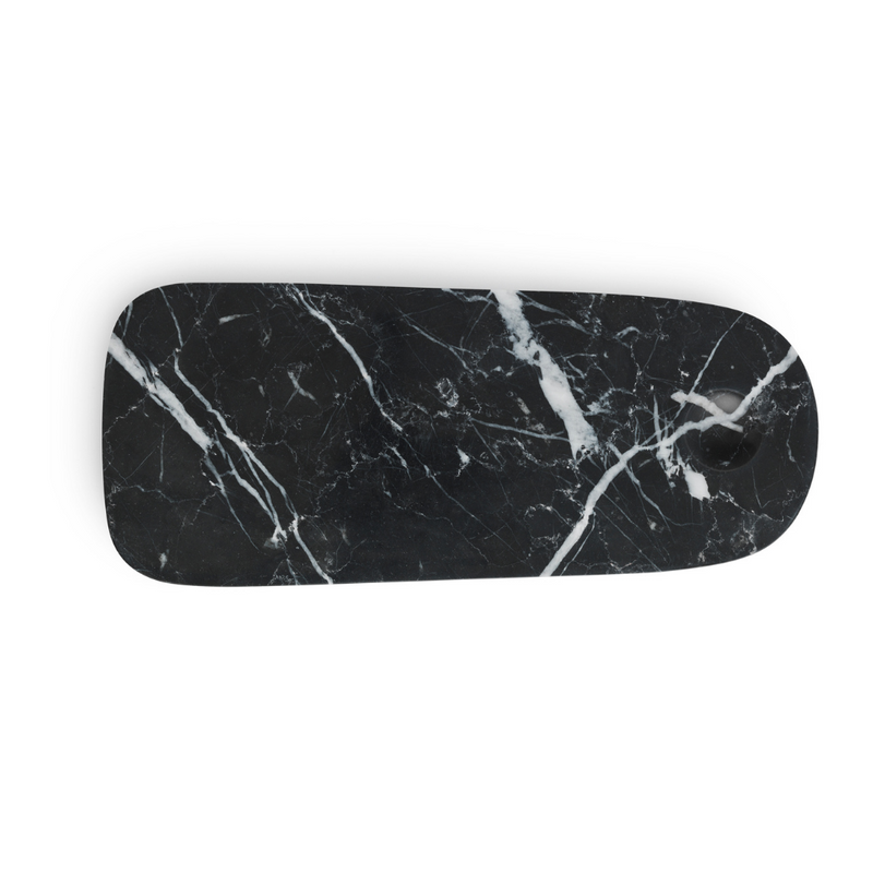 The Pebble Board in Small by Normann Copenhagen is the perfect addition to any home's kitchen decor. Made from a beautiful black marble with white and grey veining, the Pebble Board is a great way to serve up a selection of cheeses and other charcuterie, and it looks beautiful when styled with your most loved breakfast fruits and baked goods.
