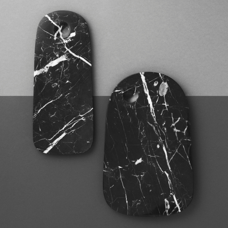 The Pebble Board in Small by Normann Copenhagen is the perfect addition to any home's kitchen decor. Made from a beautiful black marble with white and grey veining, the Pebble Board is a great way to serve up a selection of cheeses and other charcuterie, and it looks beautiful when styled with your most loved breakfast fruits and baked goods.